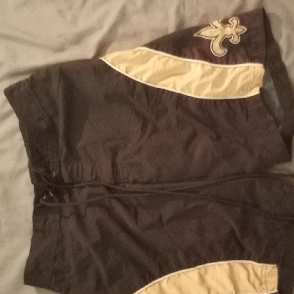 Men's New Orleans Saint's swim trunks.